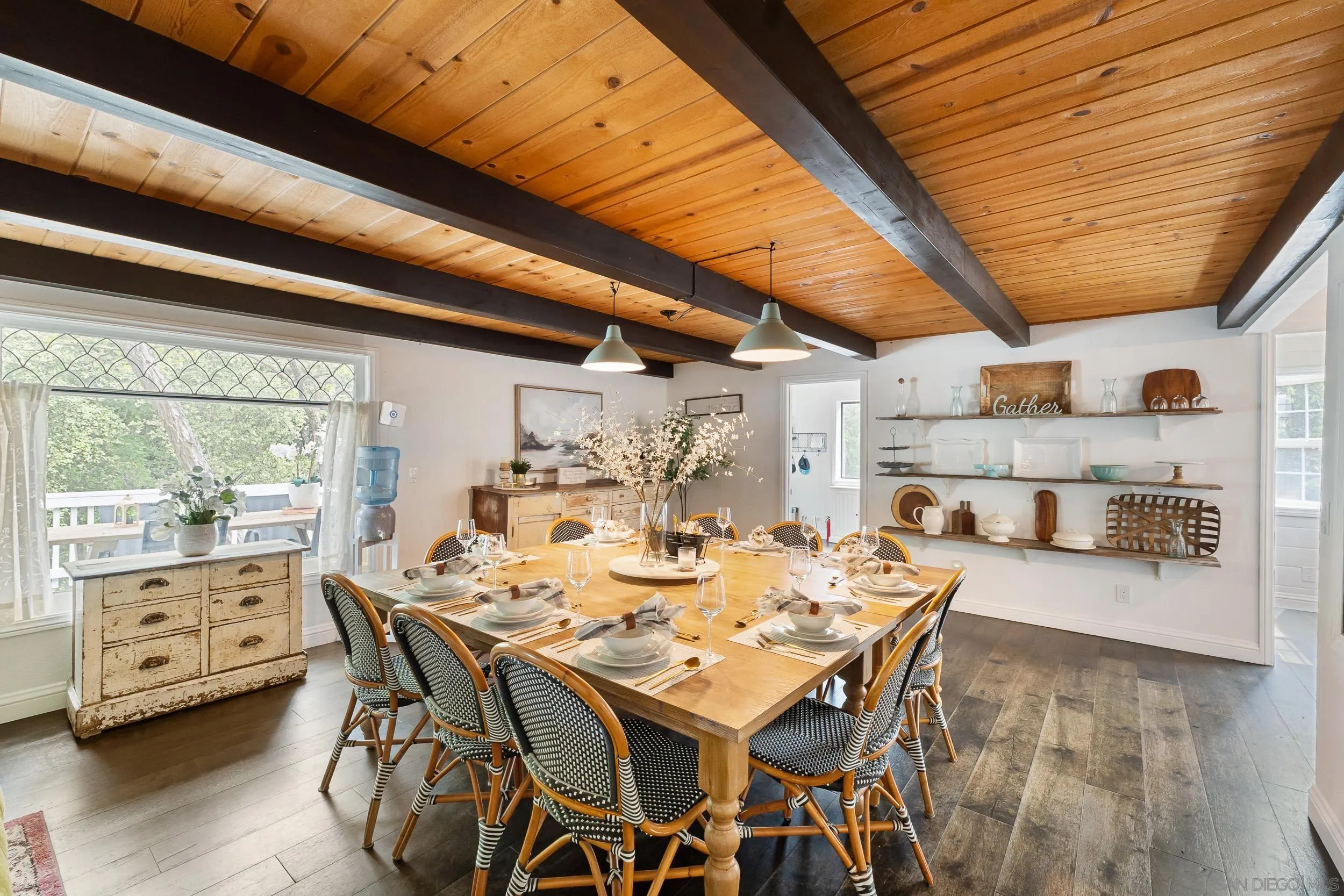 3517 Deer Lake Park Road Julian, CA 92036 - Photo 8 of 75 a dining room with a wooden table and chairs