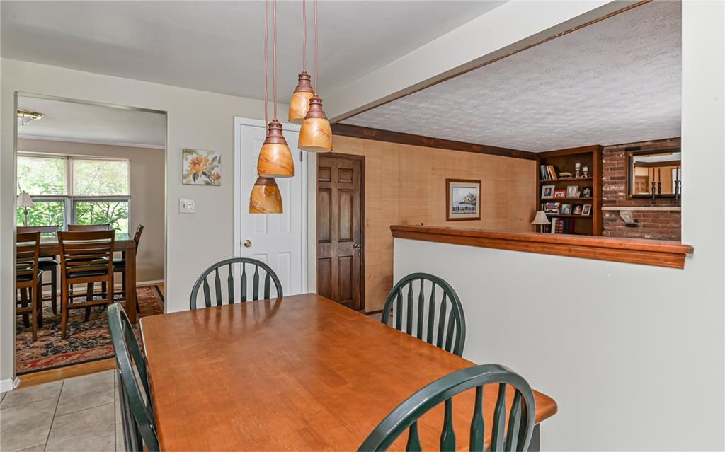1392 Old Meadow Road Pittsburgh, PA 15241 - Photo 19 of 34 a view of a dining room with furniture window and wooden floor