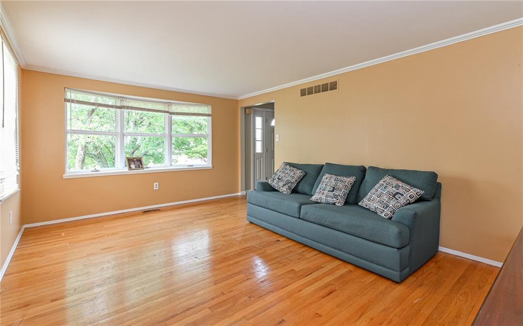 1392 Old Meadow Road Pittsburgh, PA 15241 - Photo 25 of 34 a living room with a couch and a window