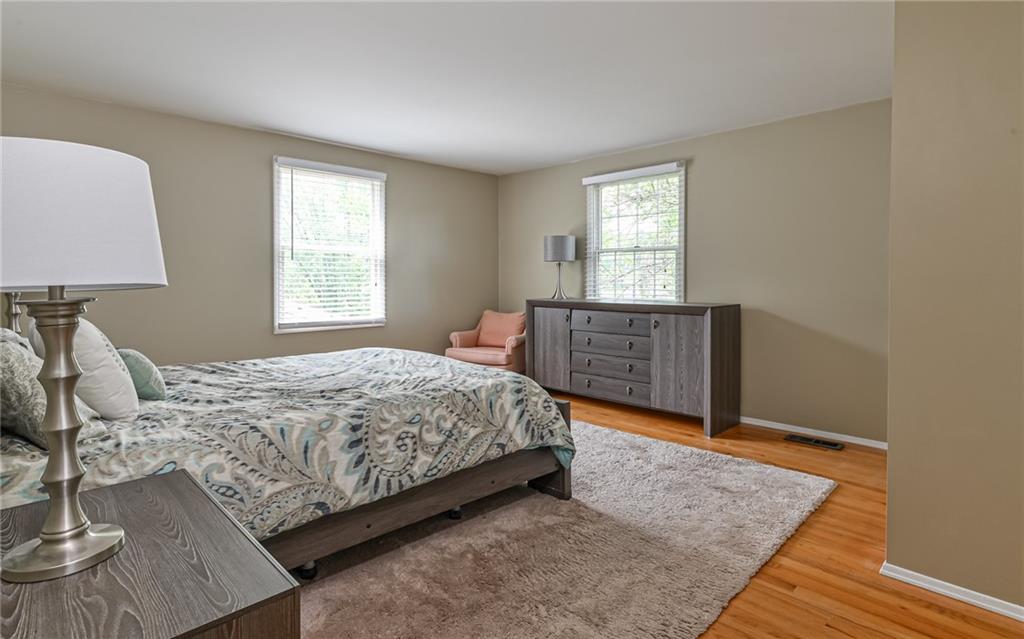 1392 Old Meadow Road Pittsburgh, PA 15241 - Photo 26 of 34 a bedroom with a bed window and a dresser