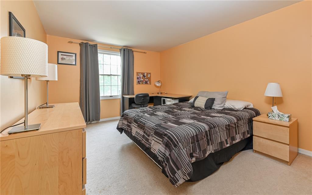 1392 Old Meadow Road Pittsburgh, PA 15241 - Photo 28 of 34 a bedroom with a bed and a lamp with the dresser