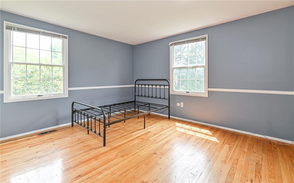 1392 Old Meadow Road Pittsburgh, PA 15241 - Photo 31 of 34 a living room with a bed furniture and a window