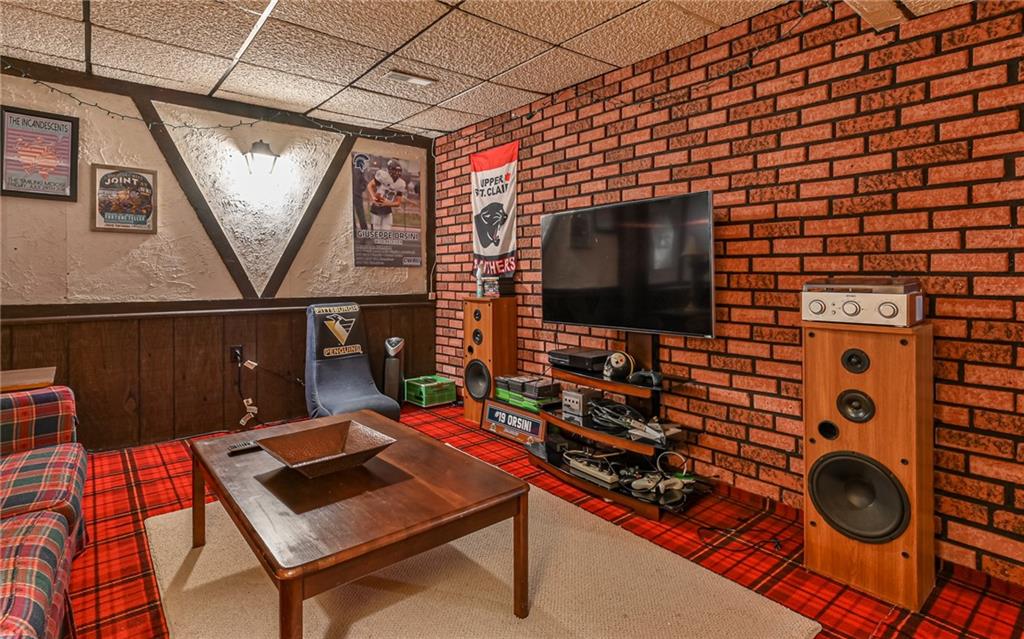 1392 Old Meadow Road Pittsburgh, PA 15241 - Photo 34 of 34 a living room with furniture and a flat screen tv