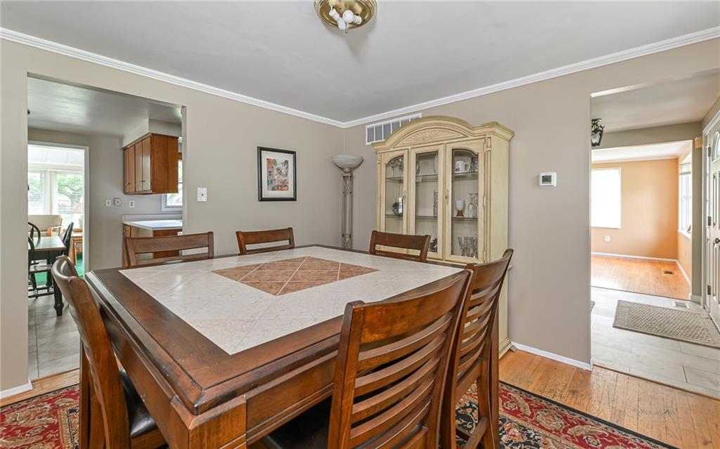 1392 Old Meadow Road Pittsburgh, PA 15241 - Photo 4 of 34 a view of a dining room with furniture window and wooden floor