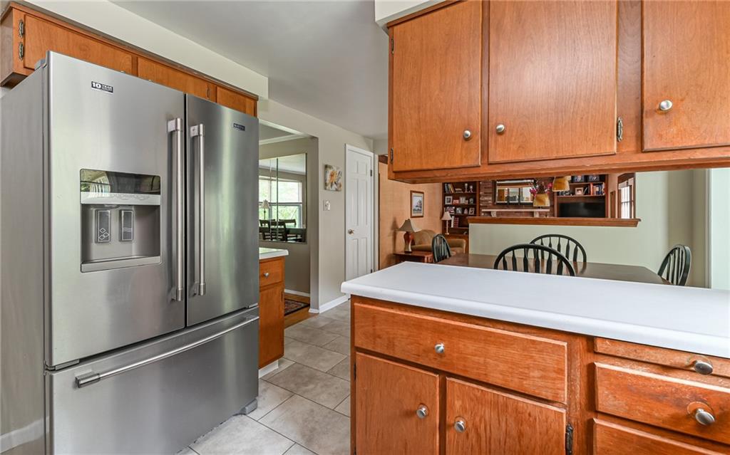 1392 Old Meadow Road Pittsburgh, PA 15241 - Photo 9 of 34 a kitchen with stainless steel appliances a refrigerator and a stove