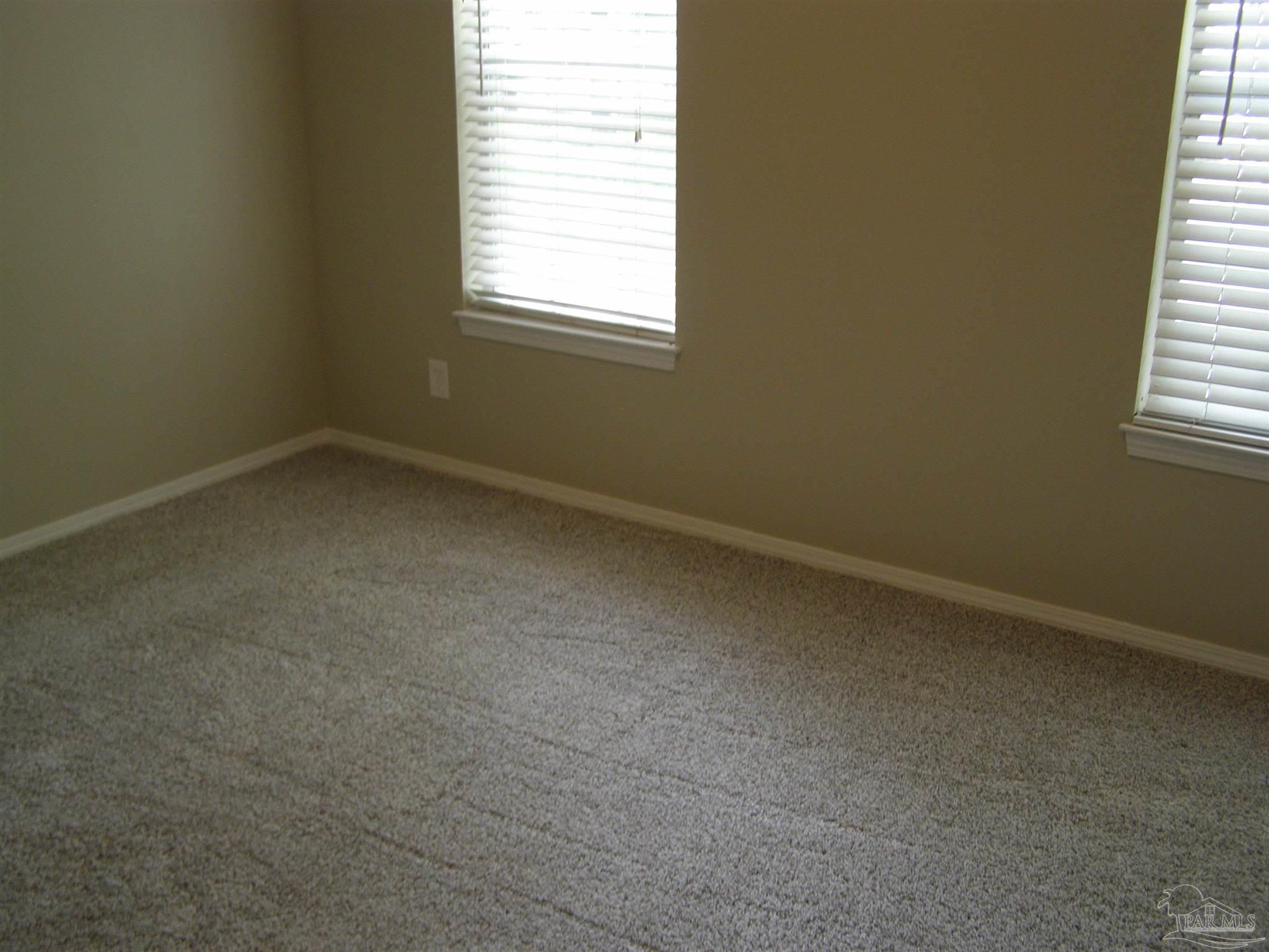 601 East Burgess Road, Unit E3 Pensacola, FL 32504 - Photo 12 of 19 an empty room with a window