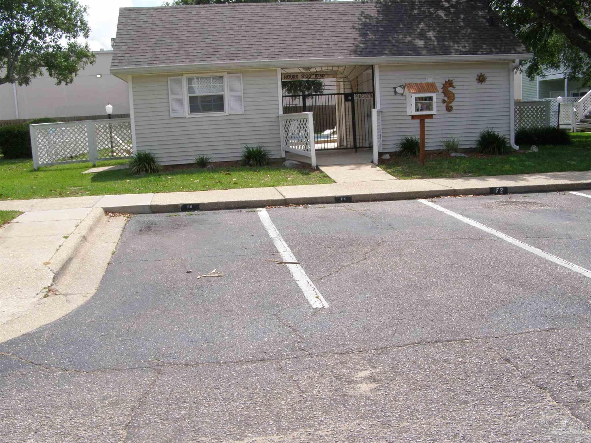 601 East Burgess Road, Unit E3 Pensacola, FL 32504 - Photo 19 of 19 a view of backyard of house with green space