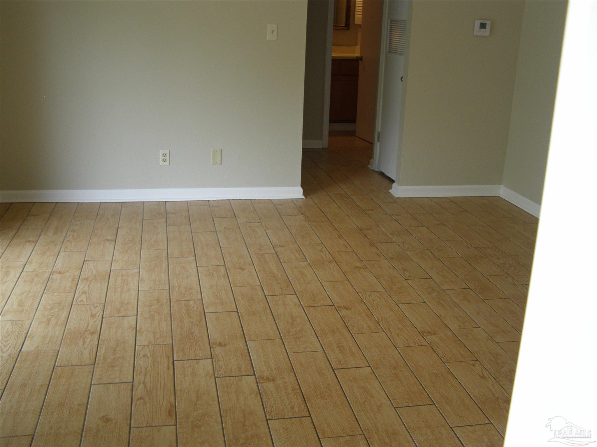 601 East Burgess Road, Unit E3 Pensacola, FL 32504 - Photo 4 of 19 wooden floor in a room