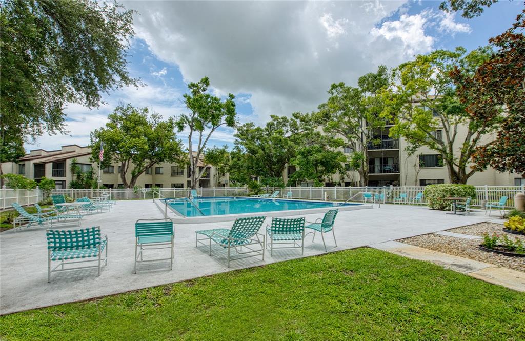 700 Starkey Road, Unit 1145 Largo, FL 33771 - Photo 40 of 63 a view of house with backyard and a garden