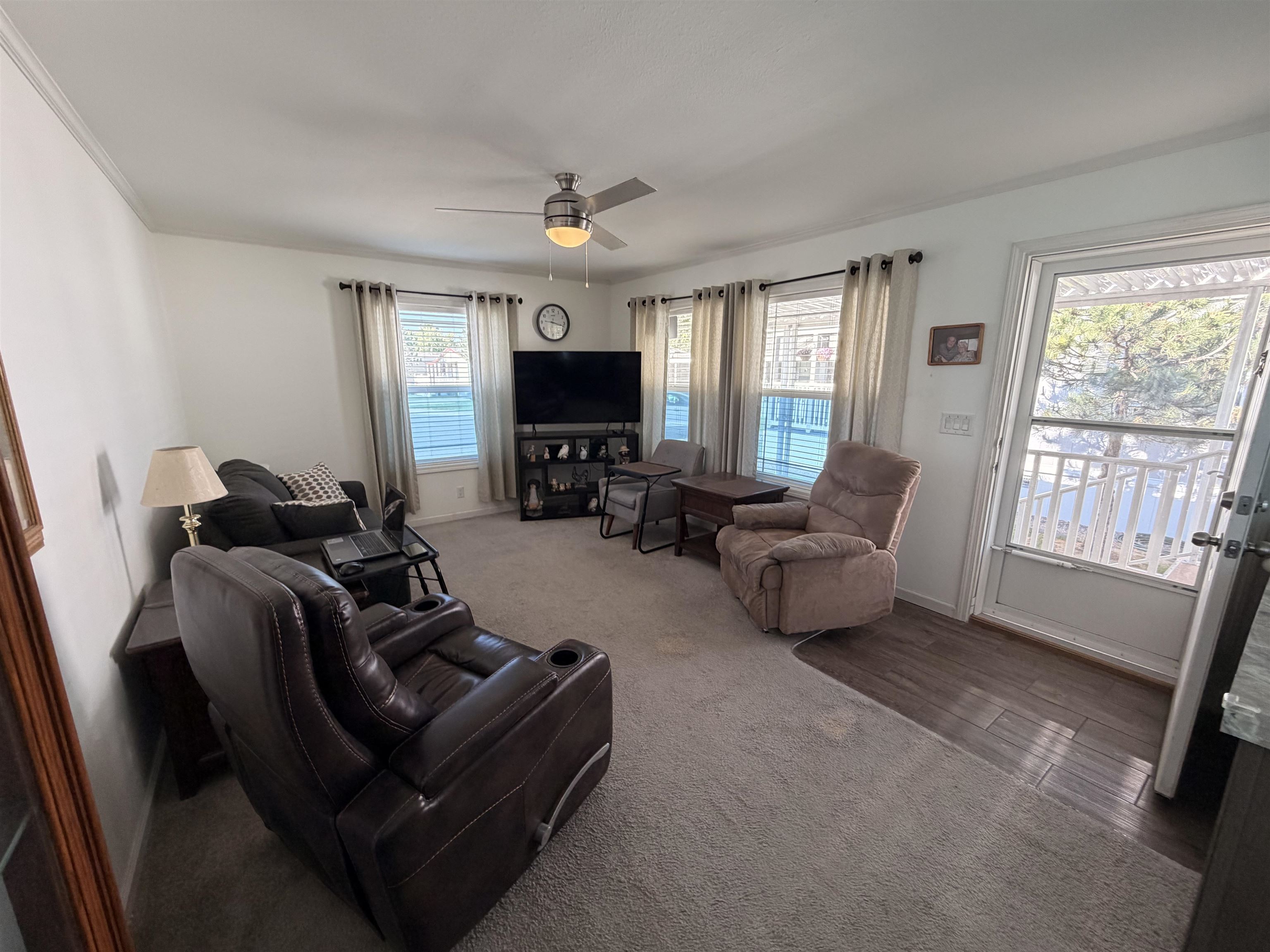 435 32 Road, Unit 826 Clifton, CO 81520 - Photo 4 of 17 a living room with furniture and a flat screen tv