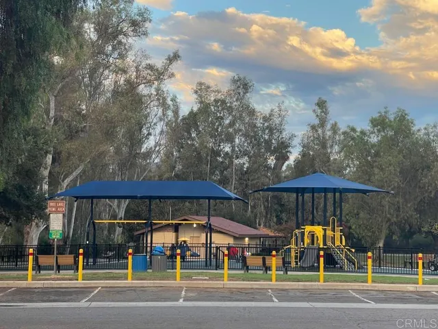 a view of street with parked cars