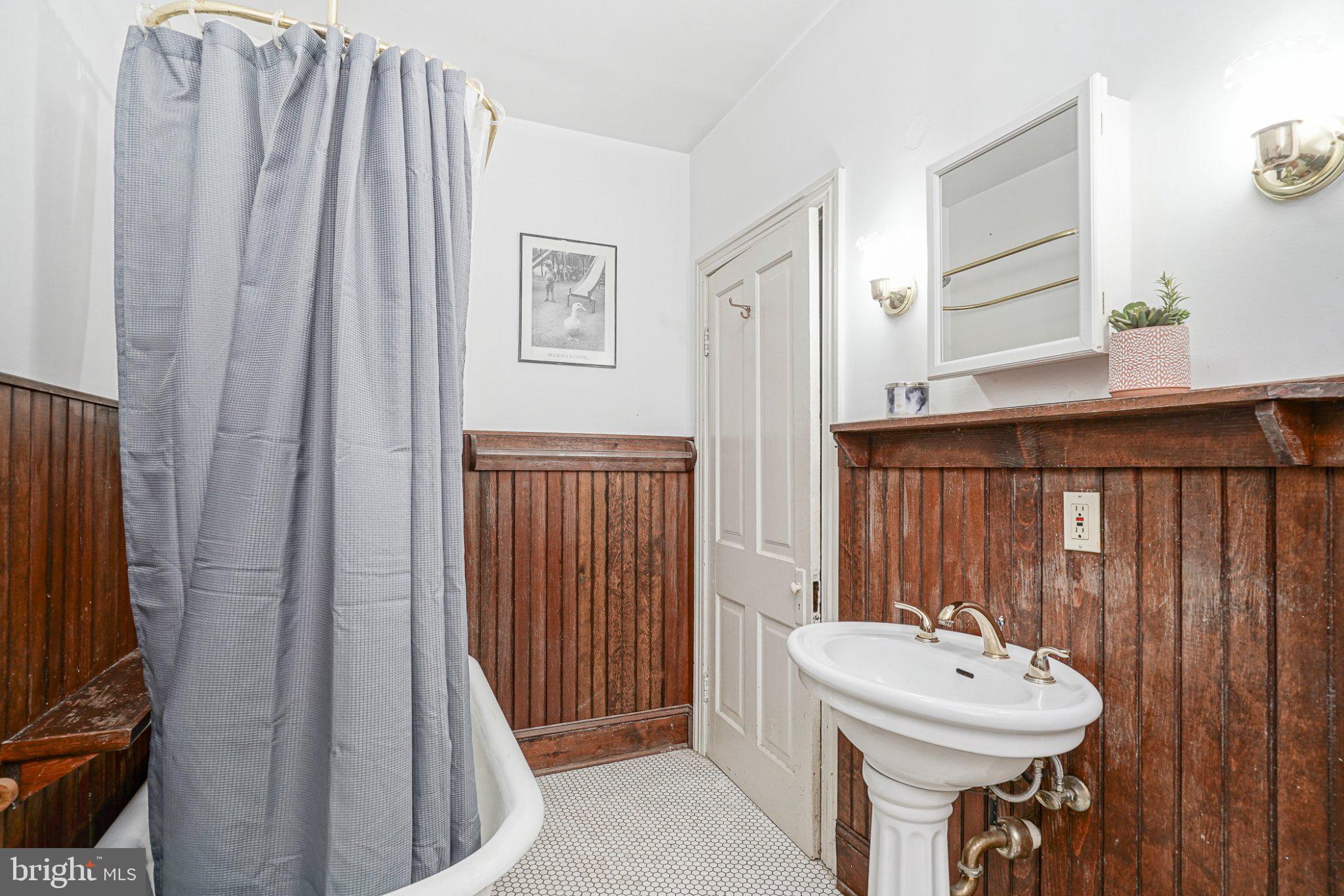 315 Chestnut Street Moorestown, NJ 08057 - Photo 14 of 36 a bathroom with a sink a mirror and a window