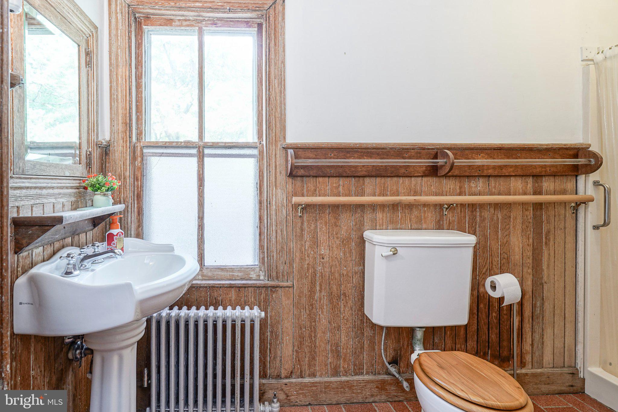 315 Chestnut Street Moorestown, NJ 08057 - Photo 21 of 36 a bathroom with a sink toilet and mirror