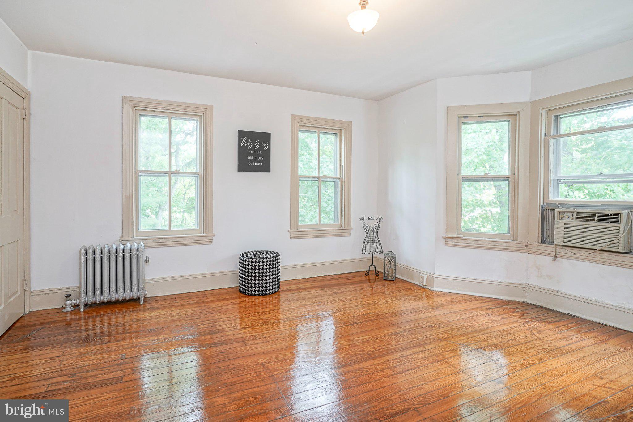 315 Chestnut Street Moorestown, NJ 08057 - Photo 22 of 36 a view of an empty room with a window and wooden floor