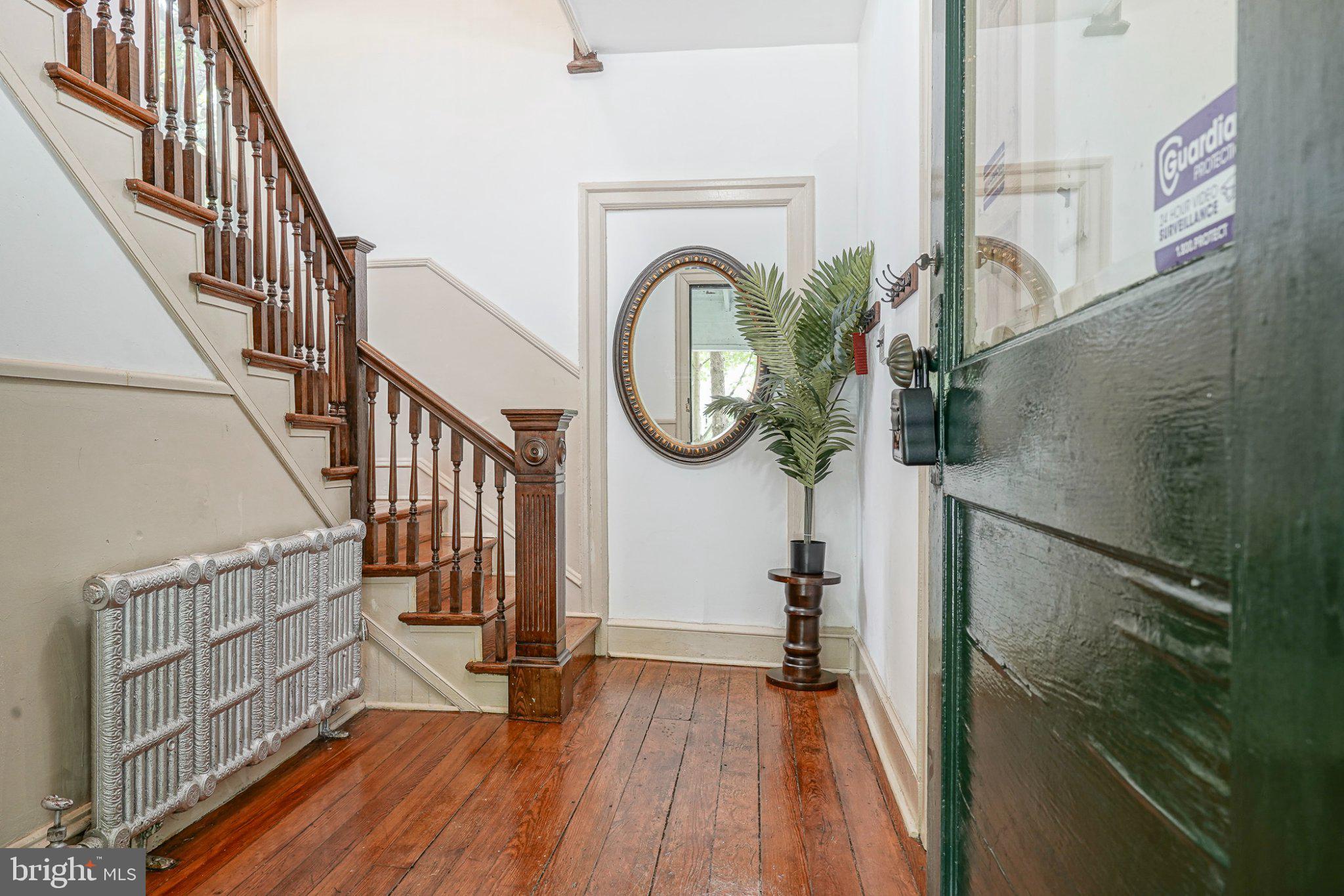 315 Chestnut Street Moorestown, NJ 08057 - Photo 3 of 36 a view of staircase with wooden floor and a large window