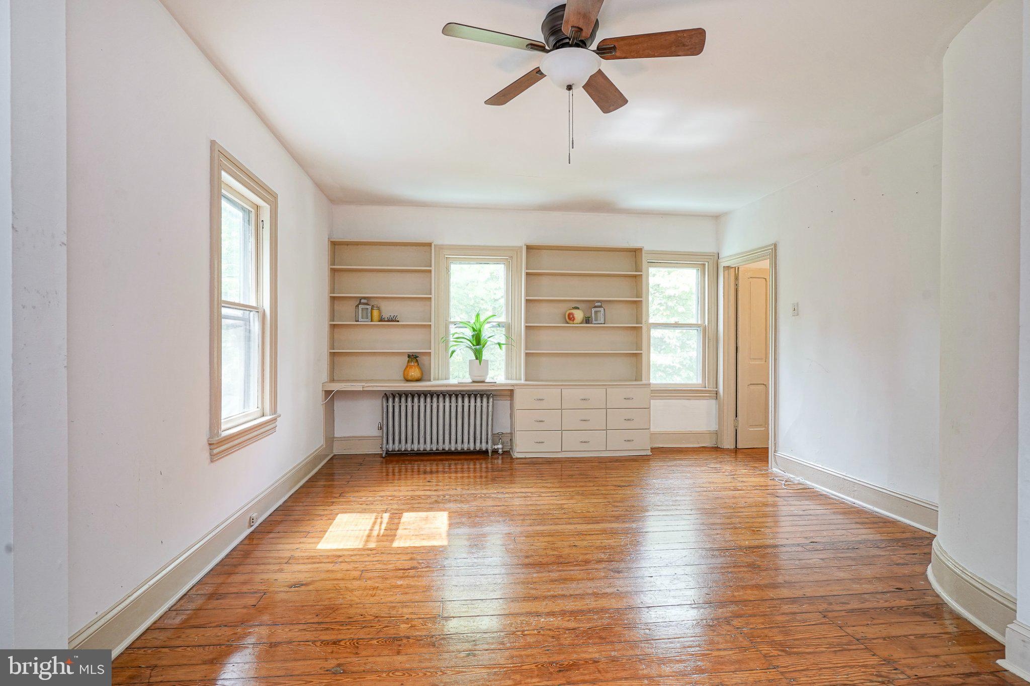 315 Chestnut Street Moorestown, NJ 08057 - Photo 9 of 36 a room with wooden floor and windows