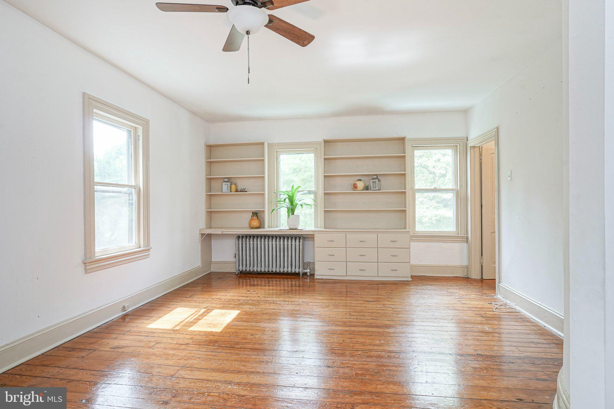 315 Chestnut Street Moorestown, NJ 08057 - Photo 10 of 36 a view of empty room with wooden floor and fan