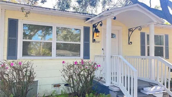 a front view of a house with a porch