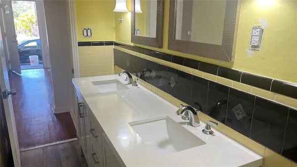 a bathroom with a sink and a mirror