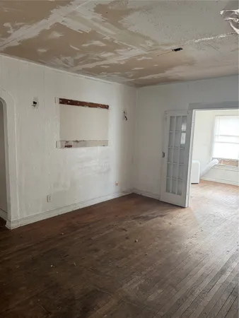 a view of livingroom with hardwood floor and hallway