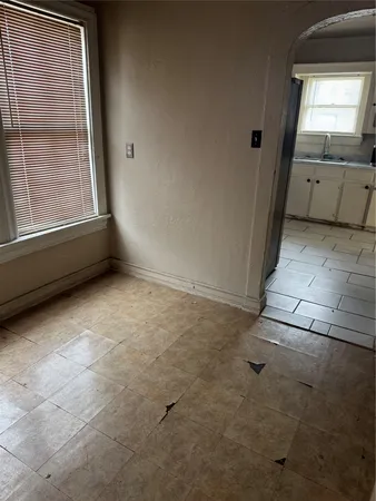 a kitchen with a stove a sink and a refrigerator