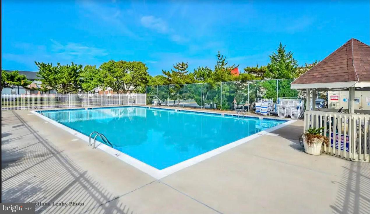 105 120th Street, Unit 84 Ocean City, MD 21842 - Photo 13 of 15 a view of a swimming pool with a patio