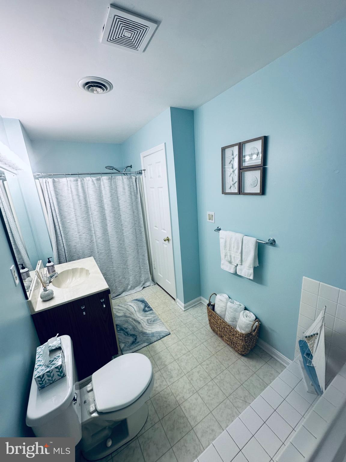 105 120th Street, Unit 84 Ocean City, MD 21842 - Photo 4 of 15 a bathroom with a sink toilet and shower