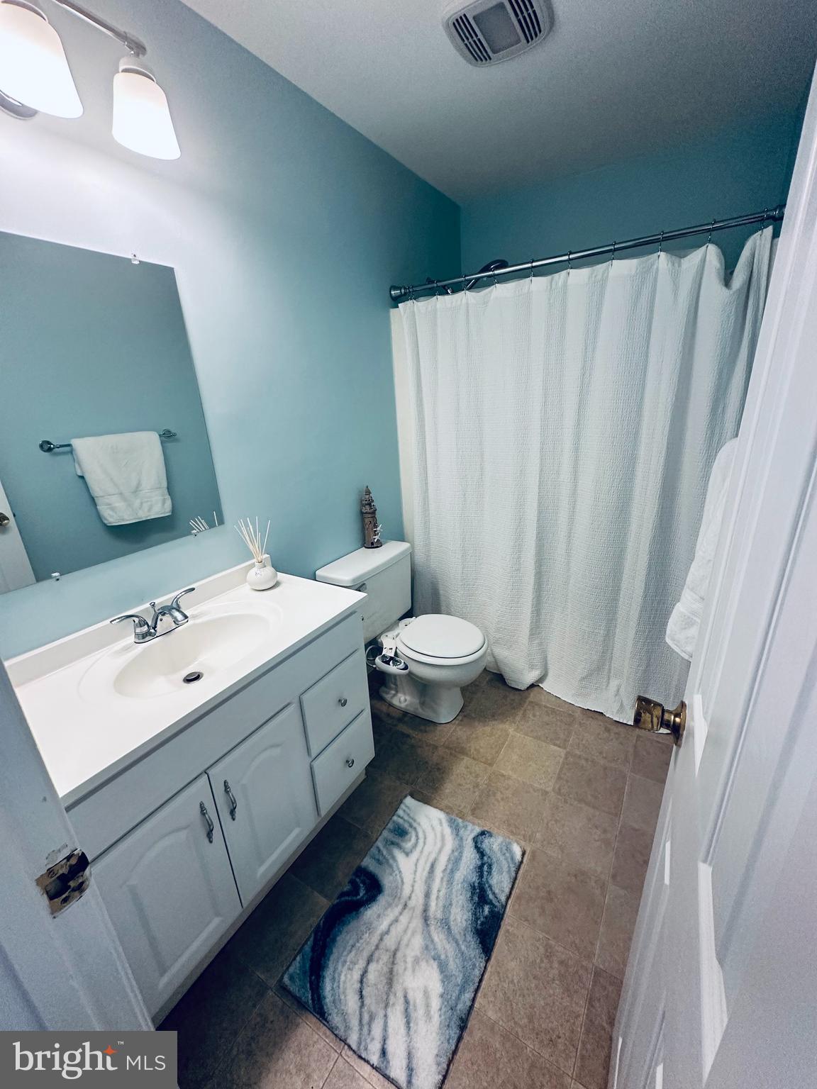 105 120th Street, Unit 84 Ocean City, MD 21842 - Photo 7 of 15 a bathroom with a sink toilet and shower