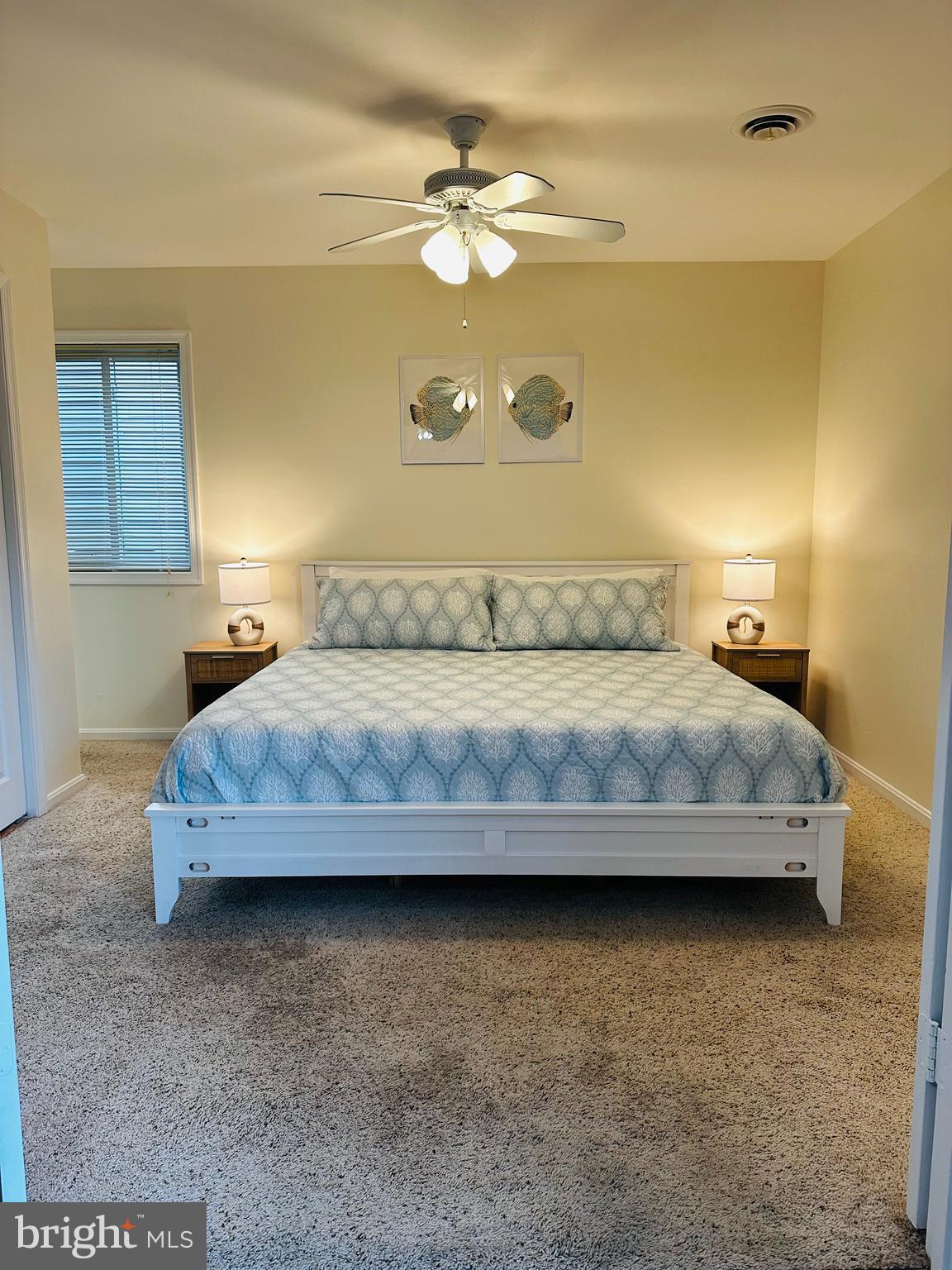 105 120th Street, Unit 84 Ocean City, MD 21842 - Photo 9 of 15 a bedroom with a bed and dresser