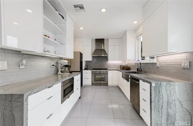 a living room with furniture and flowers