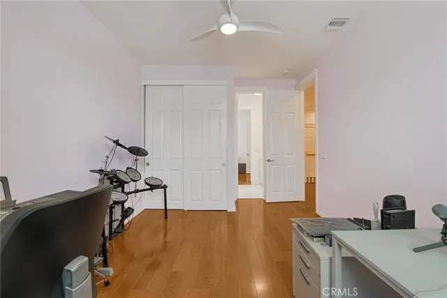 a bedroom with a bed and a chair