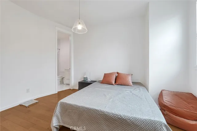 a bathroom with a double vanity sink a mirror and shower