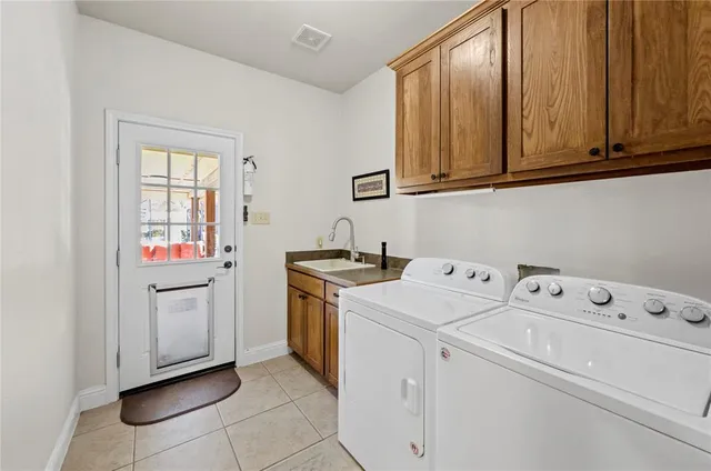 a utility room with dryer and washer