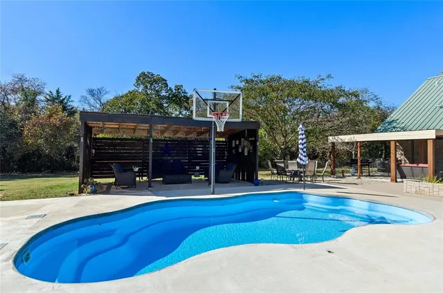 a view of a house with swimming pool