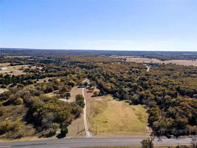 an aerial view of a residential houses and city view