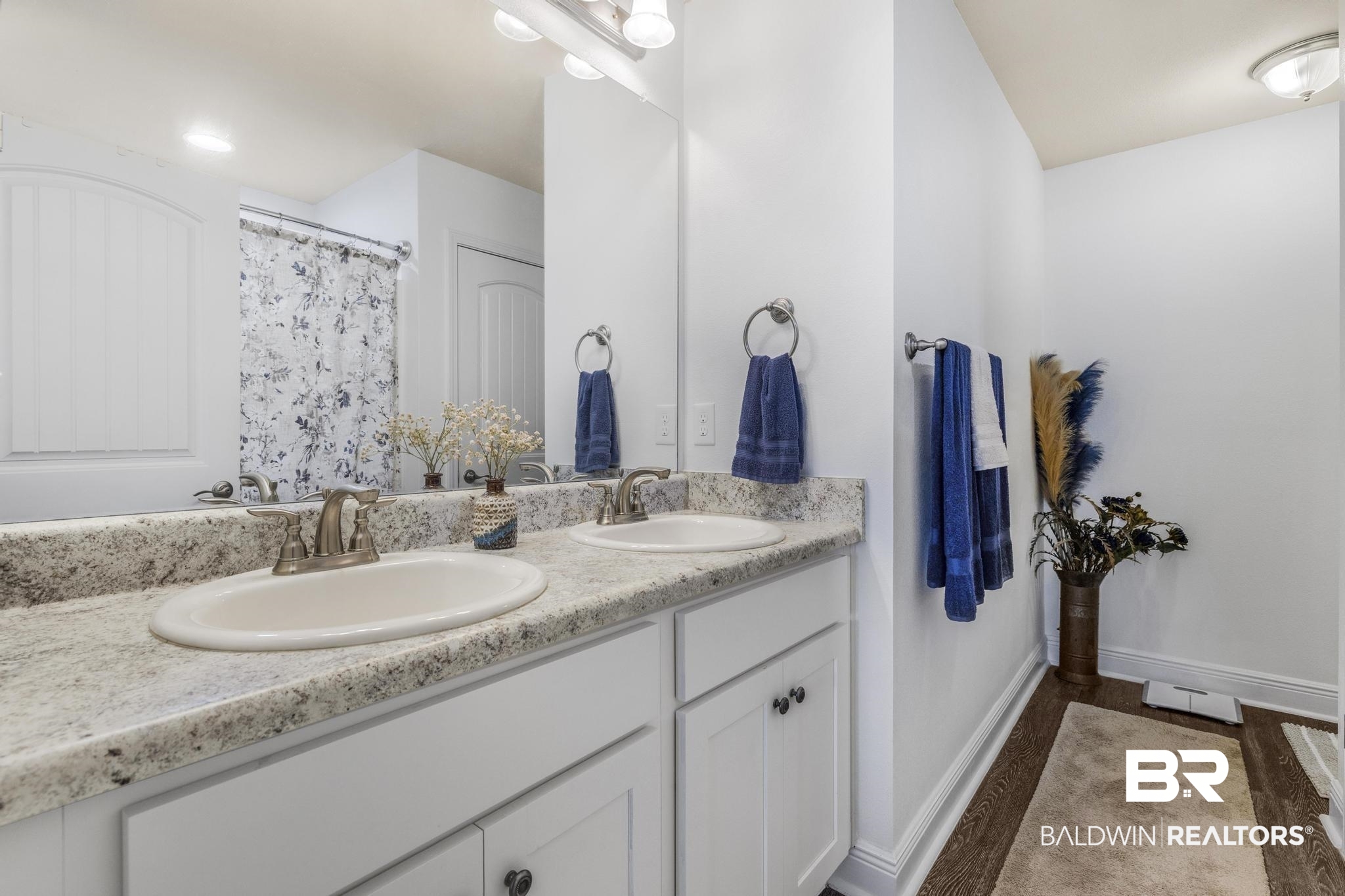 22043 Garland Loop Silverhill, AL 36576 - Photo 23 of 41 Full bathroom featuring double vanity, a shower with shower curtain, and dark wood finished floors