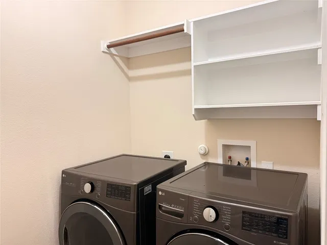 a view of a big room with windows and fireplace