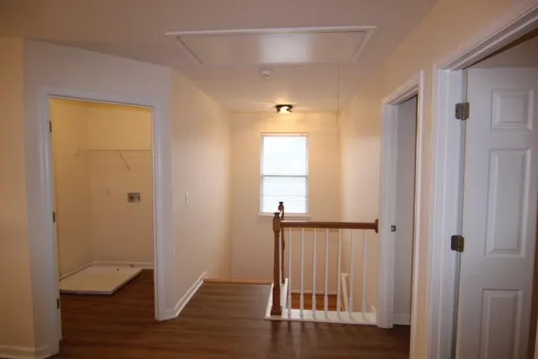 a view of entryway with wooden floor