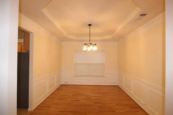 a view of a room with window and wooden floor