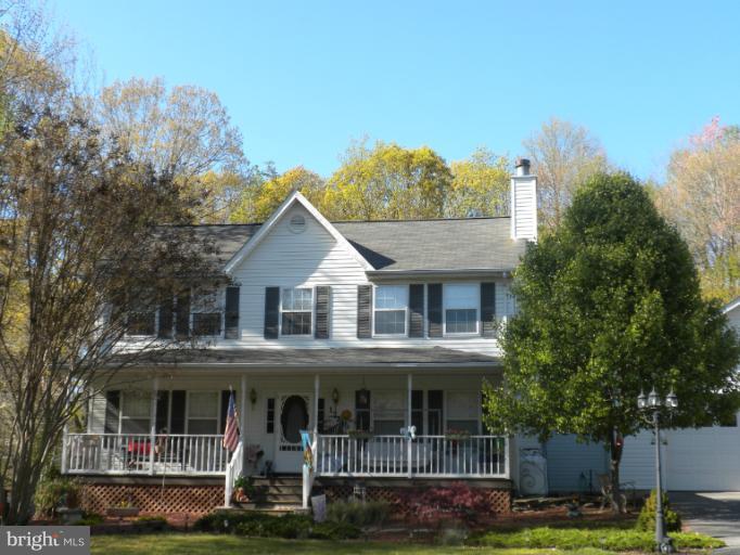 1721 Ball Road Port Republic, MD 20676 - Photo 1 of 25 a front view of a house with a yard