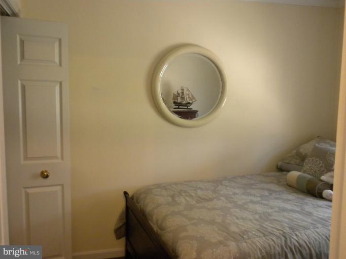1721 Ball Road Port Republic, MD 20676 - Photo 11 of 25 a bedroom with a bed and a mirror