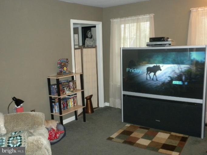 1721 Ball Road Port Republic, MD 20676 - Photo 15 of 25 a living room with furniture and a wooden floor