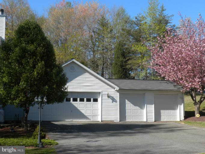 1721 Ball Road Port Republic, MD 20676 - Photo 3 of 25 a house with trees in the background
