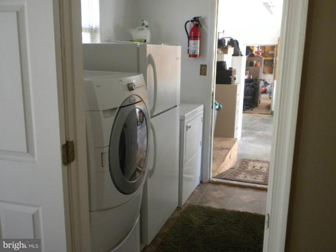 1721 Ball Road Port Republic, MD 20676 - Photo 25 of 25 a utility room with dryer and washer