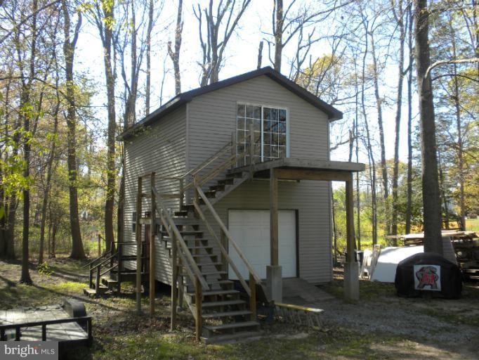 1721 Ball Road Port Republic, MD 20676 - Photo 4 of 25 a front view of a house with a yard