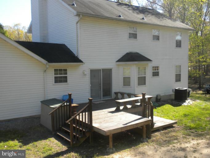 1721 Ball Road Port Republic, MD 20676 - Photo 5 of 25 a front view of a house with patio