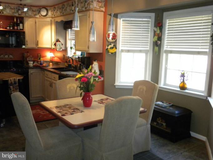 1721 Ball Road Port Republic, MD 20676 - Photo 6 of 25 a living room with furniture and a table