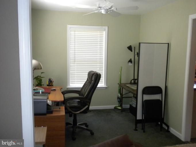 1721 Ball Road Port Republic, MD 20676 - Photo 7 of 25 a view of a workspace with furniture and a window