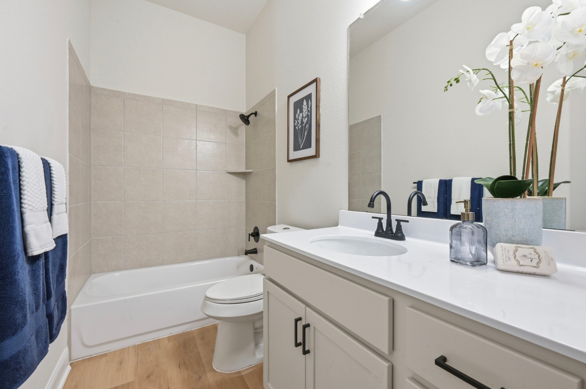 13009 Olivers Way Manchaca, TX 78652 - Photo 25 of 37 a bathroom with a granite countertop sink a toilet and shower