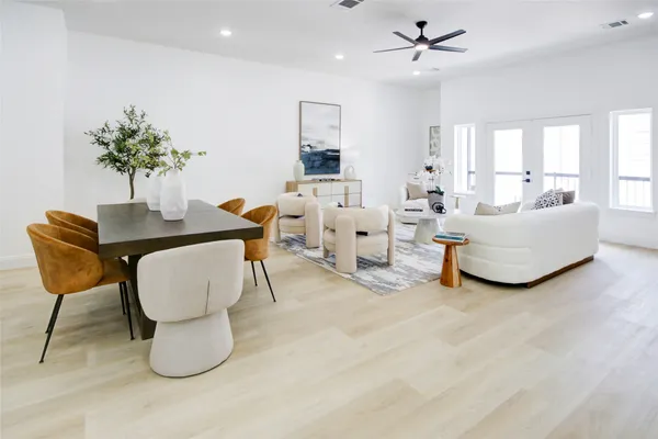 a living room with furniture and a potted plant